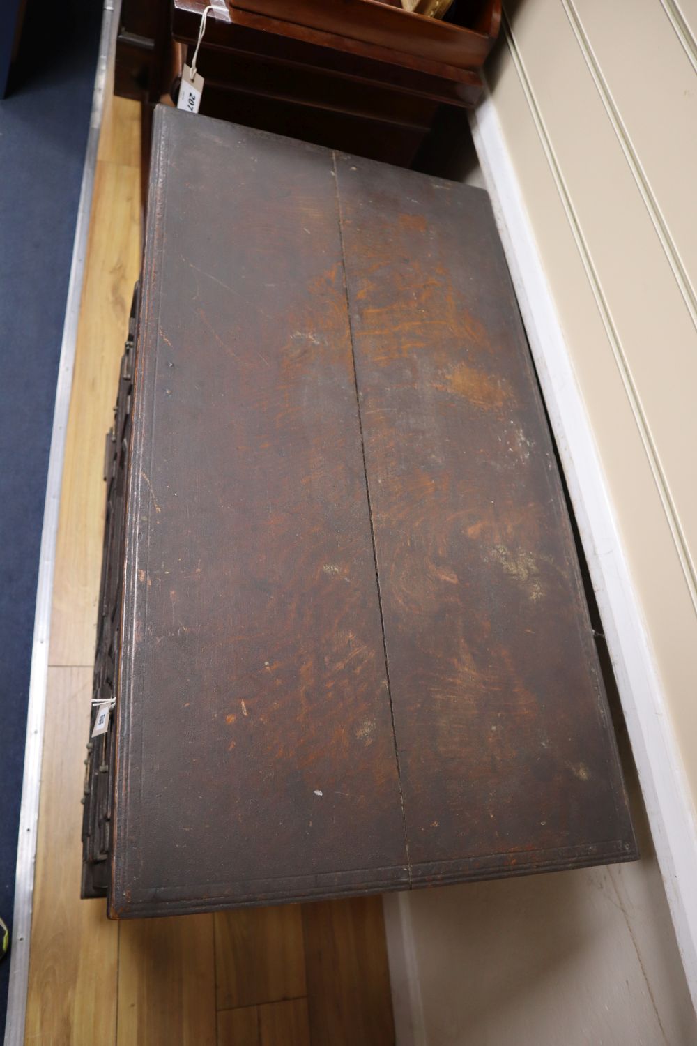 An early 18th century oak chest with hinged top, width 84cm, depth 45cm, height 85cm